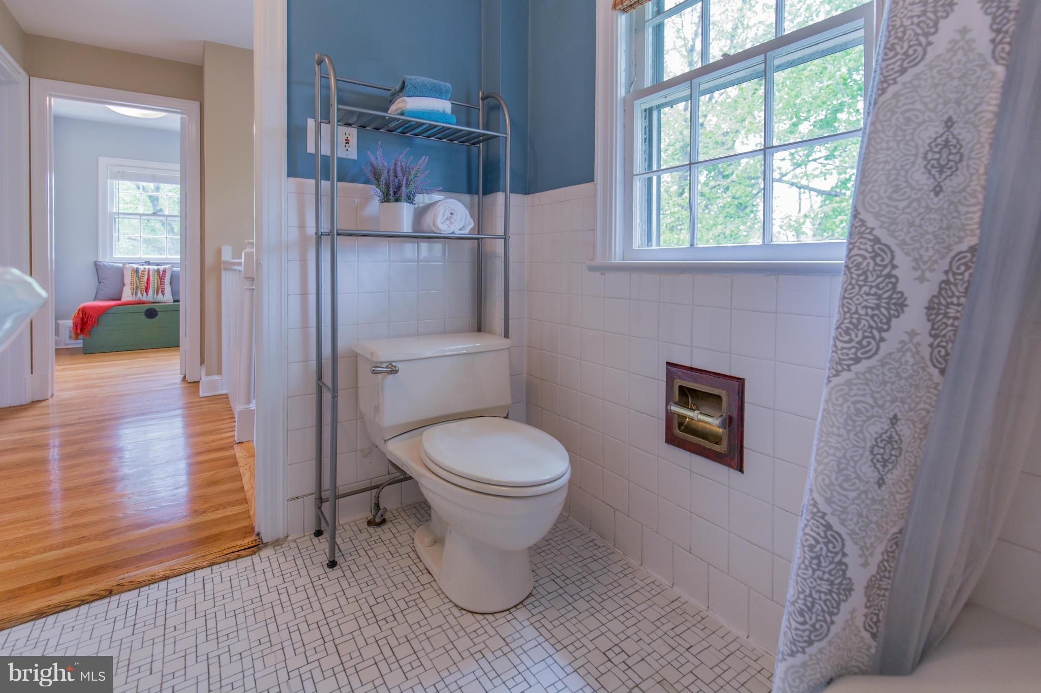 310 Brewster Court Silver Spring, MD 20901 - Photo 24 of 30 a bathroom with a toilet and a shower
