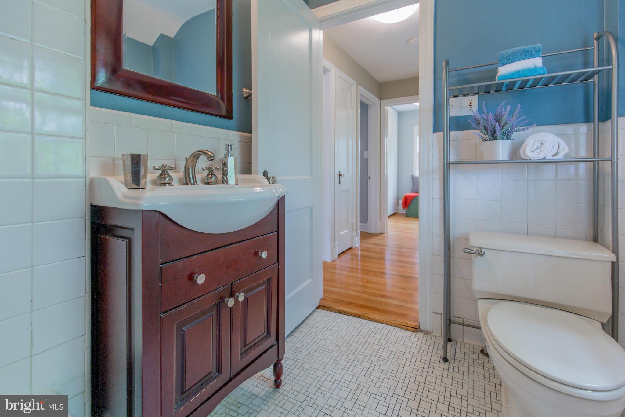 310 Brewster Court Silver Spring, MD 20901 - Photo 25 of 30 a bathroom with a sink a toilet and shower