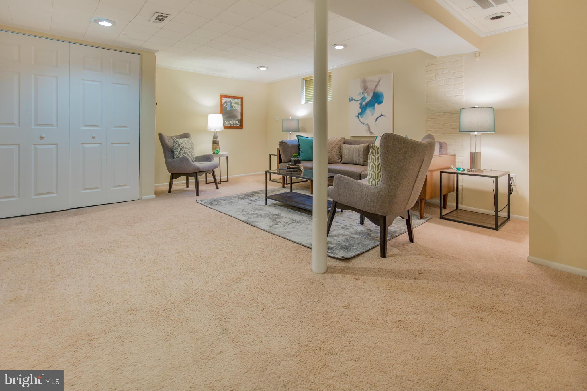 310 Brewster Court Silver Spring, MD 20901 - Photo 26 of 30 a living room with furniture and a couch