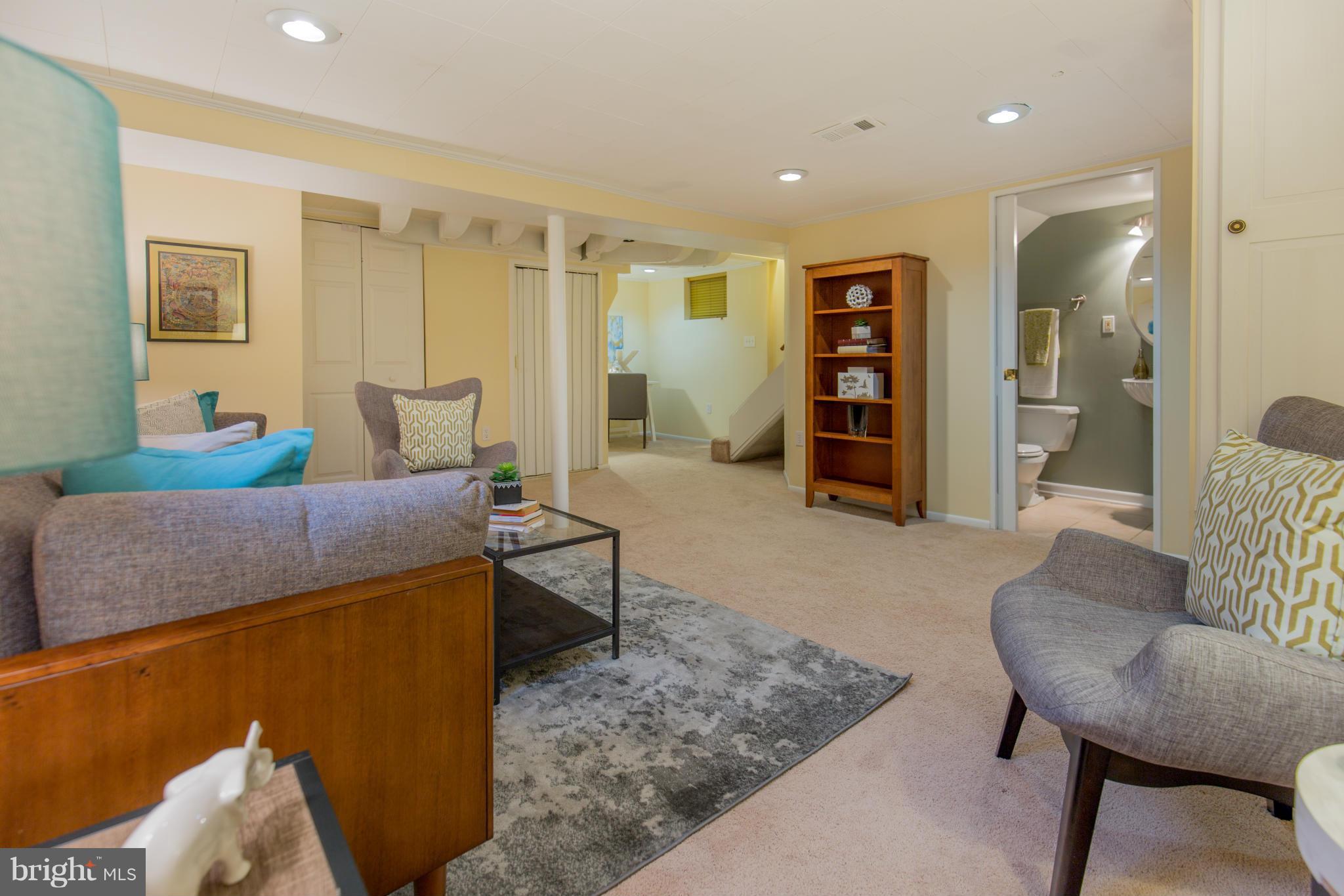 310 Brewster Court Silver Spring, MD 20901 - Photo 28 of 30 a living room with furniture and wooden floor