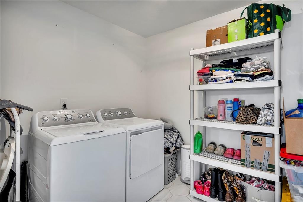 2328 Carnes Road Jonesboro, GA 30236 - Photo 16 of 36 a utility room with dryer and washer