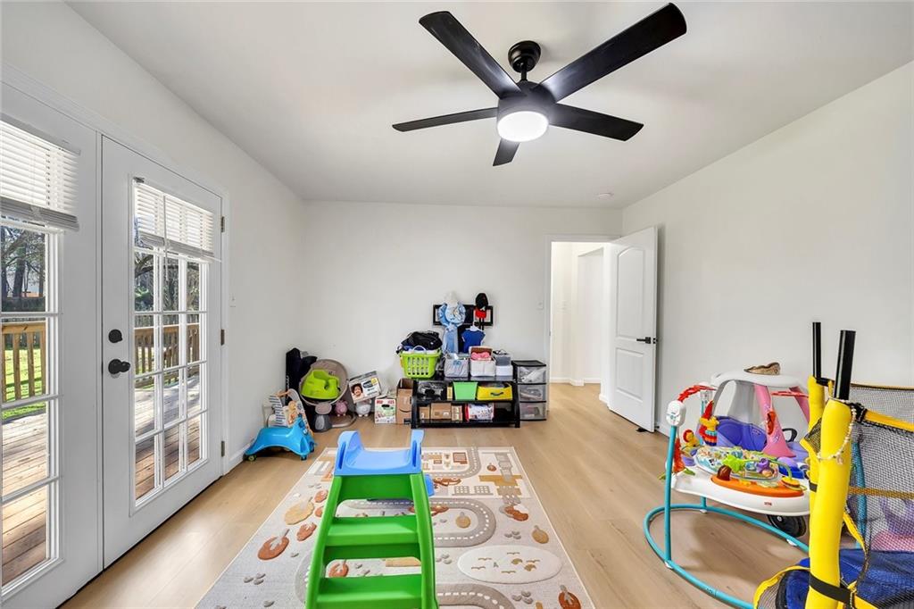 2328 Carnes Road Jonesboro, GA 30236 - Photo 19 of 36 a children room with toys and a wooden floor