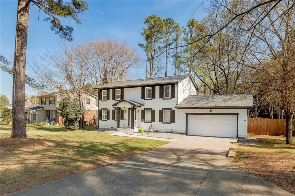 2328 Carnes Road Jonesboro, GA 30236 - Photo 2 of 36 a front view of a house with a yard
