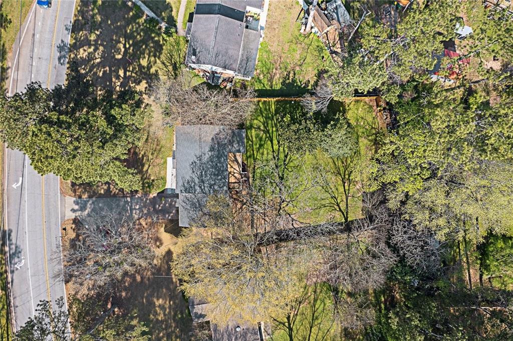 2328 Carnes Road Jonesboro, GA 30236 - Photo 36 of 36 a backyard of a building with large trees