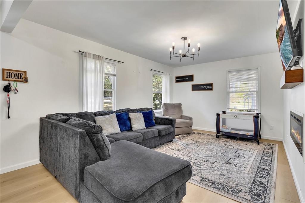 2328 Carnes Road Jonesboro, GA 30236 - Photo 5 of 36 a living room with furniture ceiling fan and a window