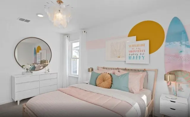 a bedroom with a bed and a dresser