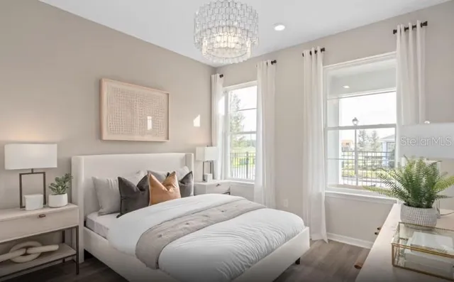 a bedroom with bed and a window