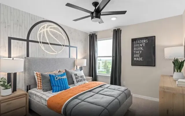 a bed room with a bed and a painting on the wall