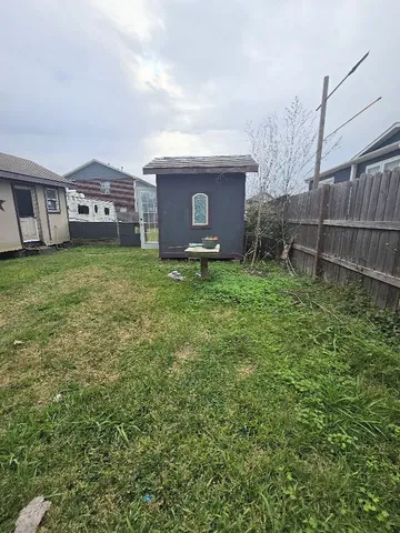 a view of a backyard of the house