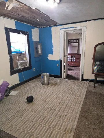 a bedroom with furniture and a dresser