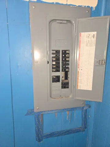 a bathroom with a window and mirror