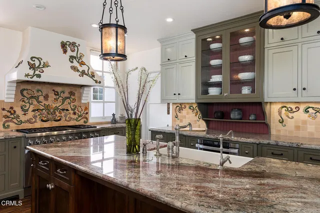 a kitchen with sink cabinets and wooden floor