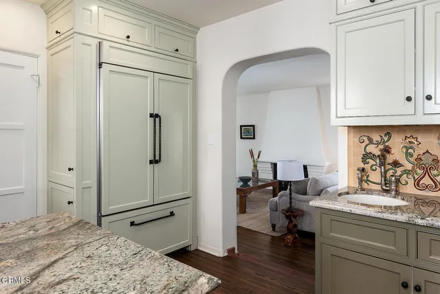a view of a livingroom with furniture and hardwood floor
