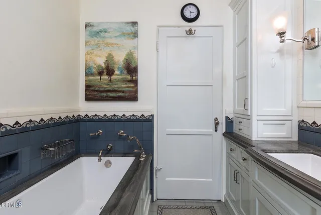 a view of a two chairs in the balcony