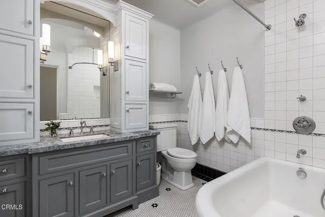 a bedroom with a large bed and a couch