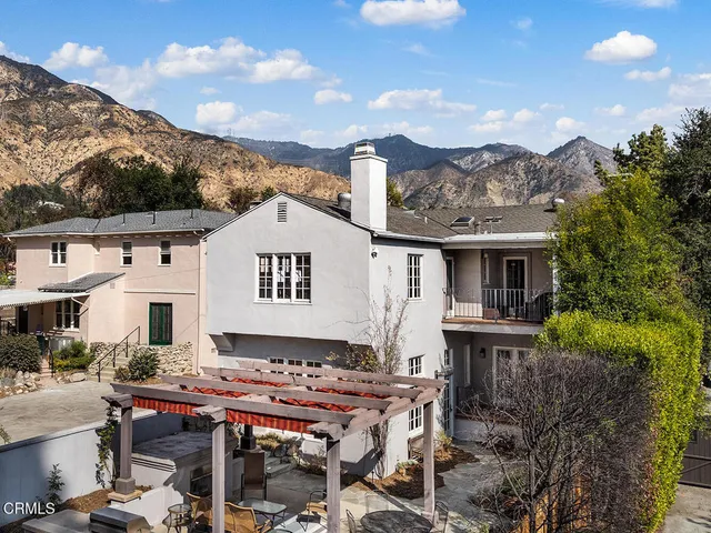 a view of a chairs and table in patio