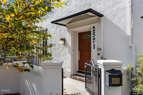 a view of a patio with table and chairs and potted plants