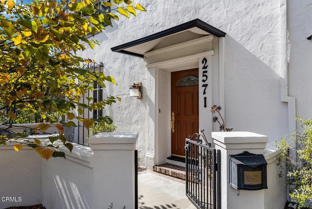 a view of a patio with table and chairs and potted plants