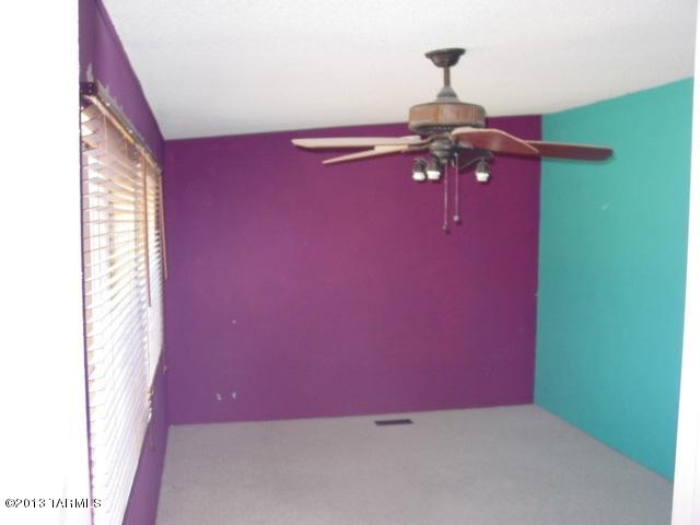 5201 North Lak A Yucca Road Tucson, AZ 85743 - Photo 9 of 19 a view of a livingroom with a chandelier fan