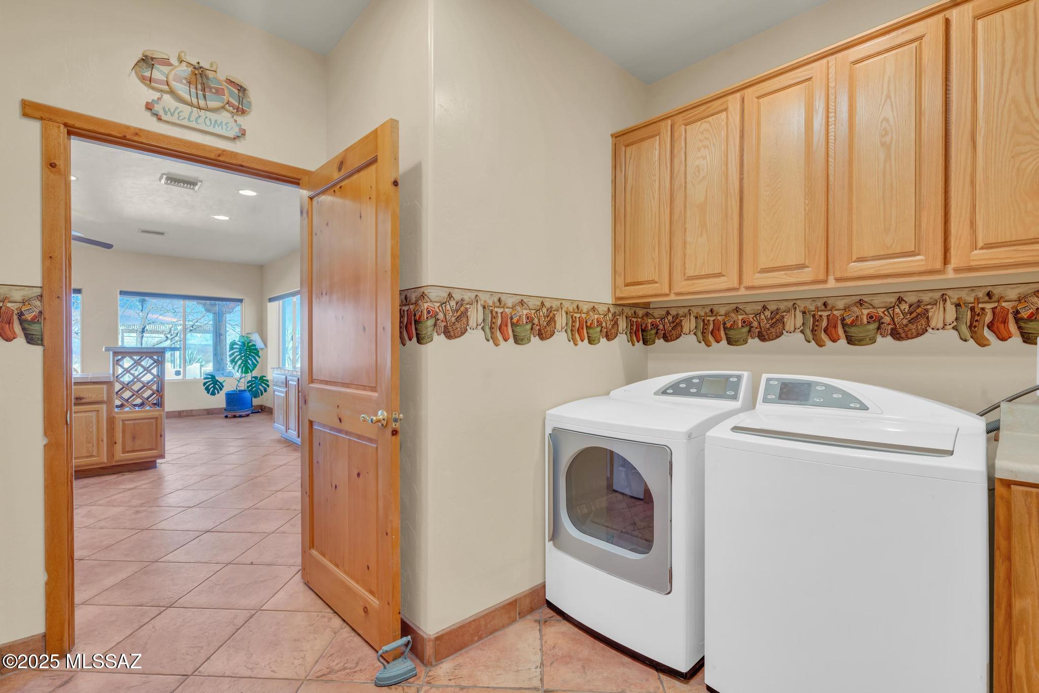 1794 Oahu Court Rio Rico, AZ 85648 - Photo 38 of 48 a view of a hallway with washer and dryer