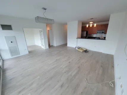 a view of a livingroom with furniture and wooden floor