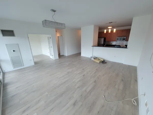 a view of a livingroom with furniture and wooden floor