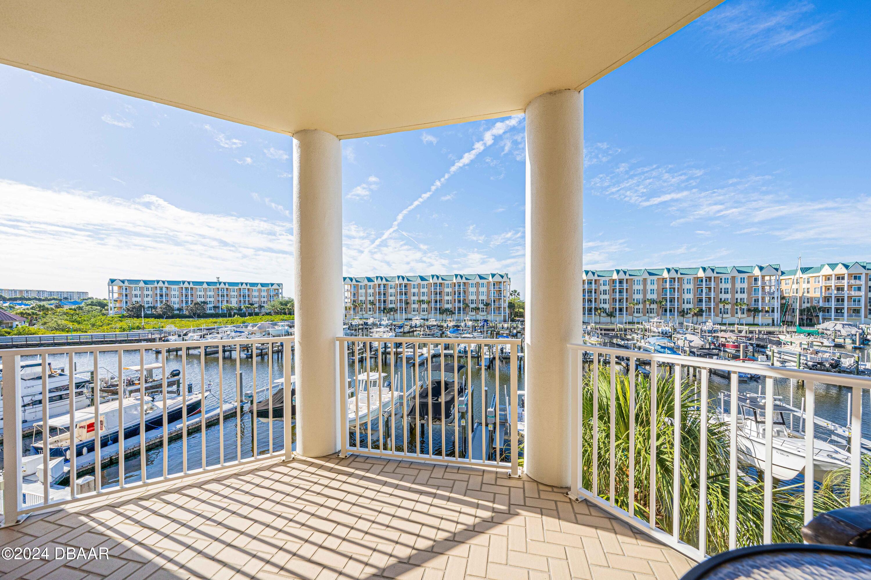 4625 Rivers Edge Village Lane, Unit 5301 Ponce Inlet, FL 32127 - Photo 18 of 50 SOUTH PATIO TO MARINA VIEW