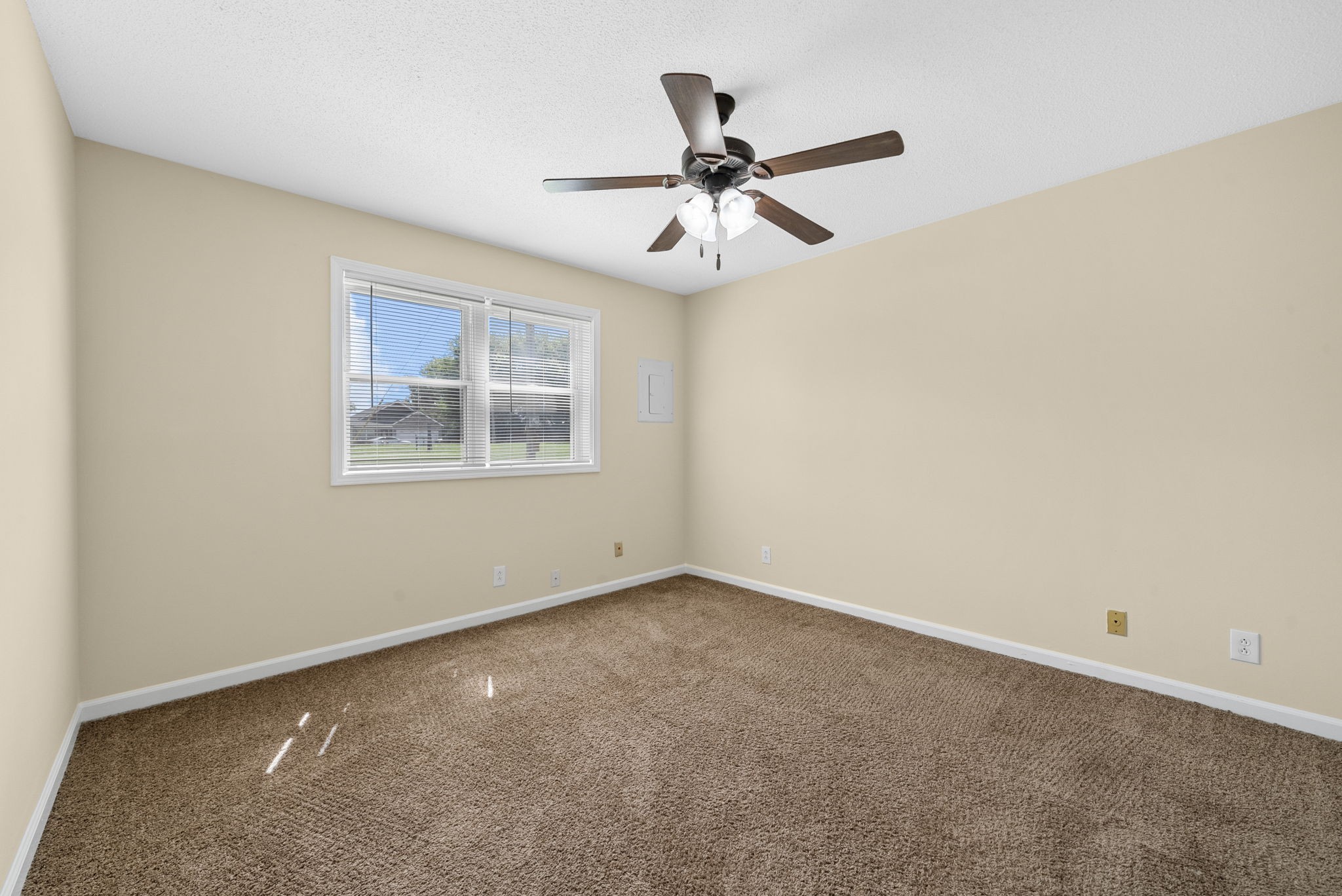 812 Pembroke Oak Grove Road, Unit 12 Oak Grove, KY 42262 - Photo 10 of 12 an empty room with a window and a fan