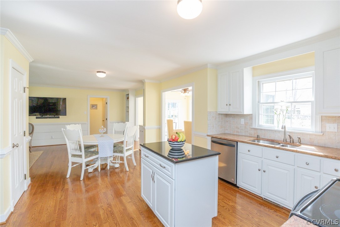 12701 Foxstone Road Midlothian, VA 23113 - Photo 6 of 34 a kitchen with a sink cabinets and wooden floor