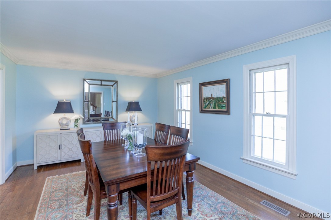 12701 Foxstone Road Midlothian, VA 23113 - Photo 8 of 34 a view of a dining room with furniture and chandelier