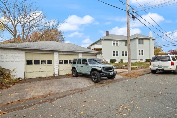 a view of a car park in front of house