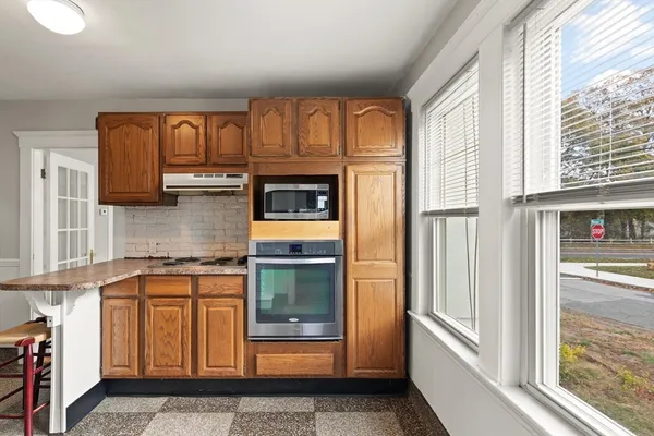 a view of front door with washer and dryer