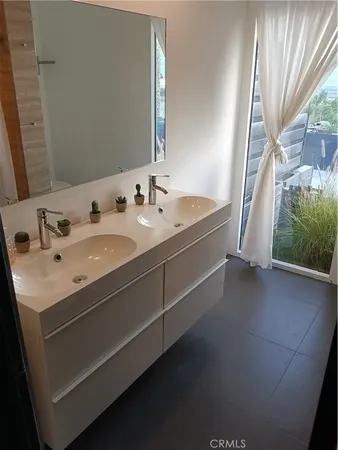 a bathroom with a sink and mirror