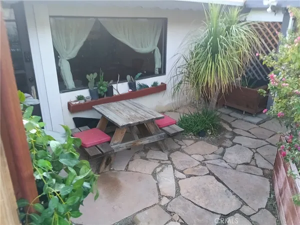 a view of yard with patio