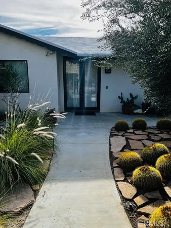 a backyard of a house with seating space