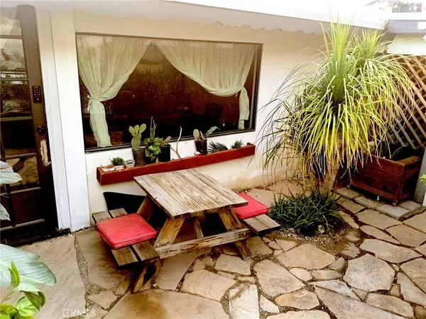a outdoor living space with furniture and a potted plant