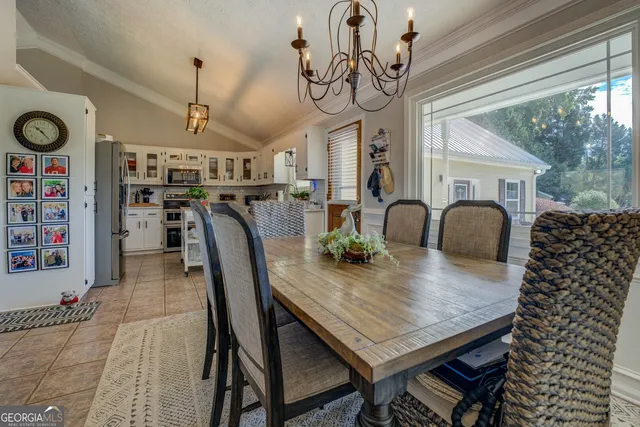 a bedroom with a bed and flat screen tv