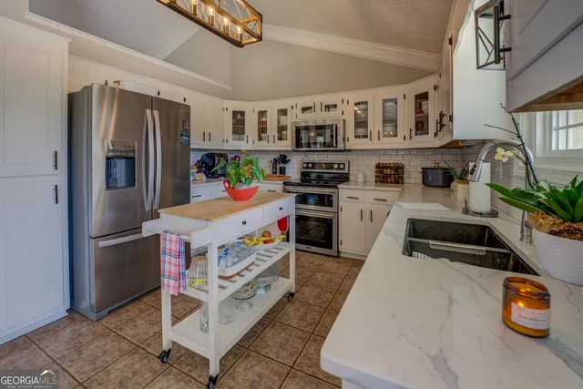 a view of a chairs and table in the balcony