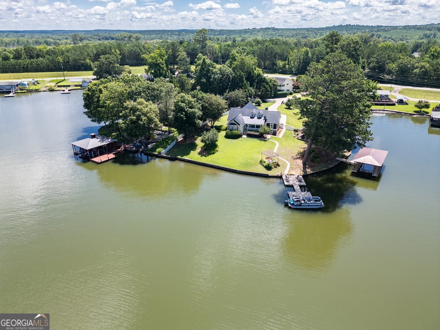 8950 Jackson Lake Road Monticello, GA 31064 - Photo 3 of 88 an aerial view of a house with a lake view