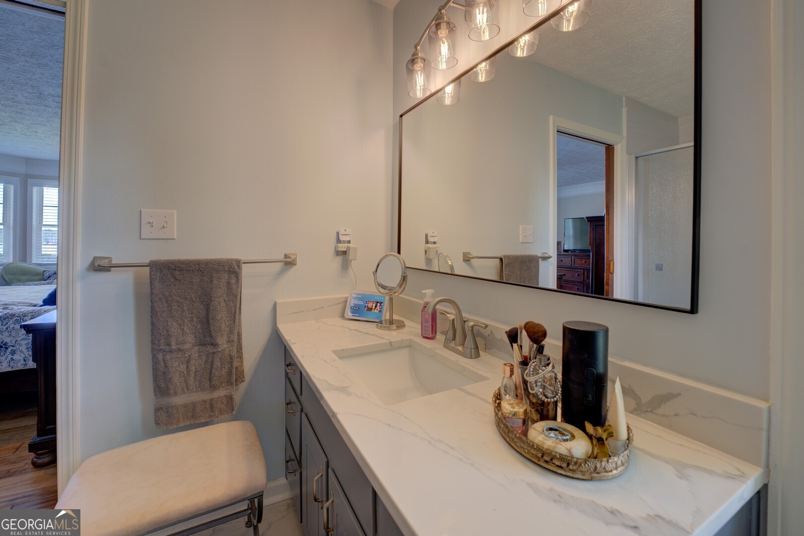 8950 Jackson Lake Road Monticello, GA 31064 - Photo 31 of 88 a bathroom with a sink a toilet and mirror