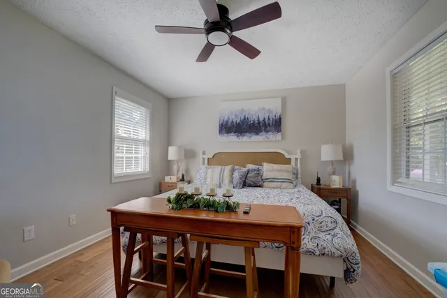 a backyard of a house with lots of green space and fountain