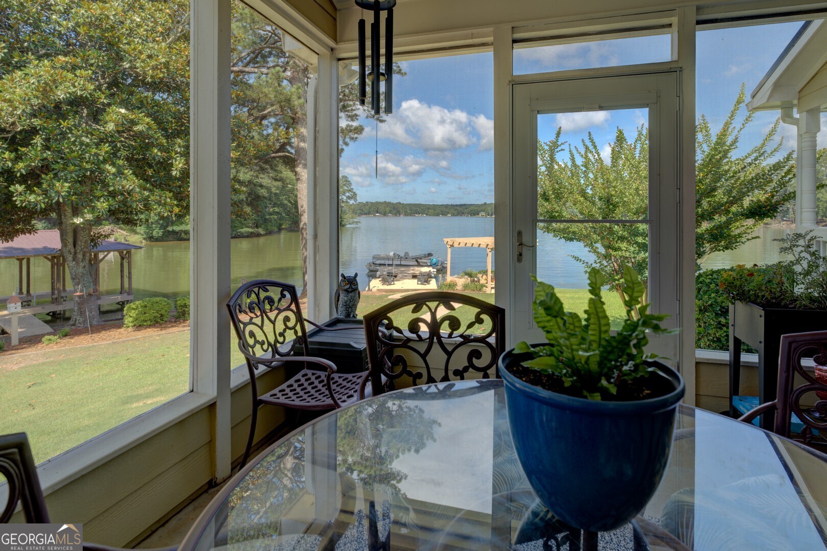 8950 Jackson Lake Road Monticello, GA 31064 - Photo 40 of 88 a view of a chairs and table in the balcony