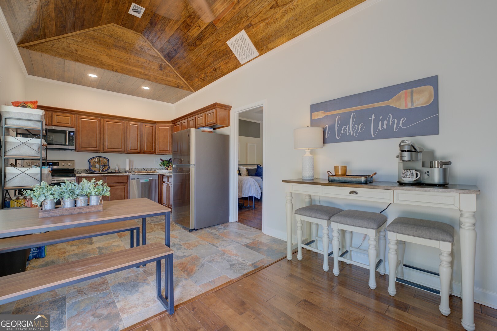 8950 Jackson Lake Road Monticello, GA 31064 - Photo 42 of 88 a kitchen with stainless steel appliances granite countertop a refrigerator and a stove top oven