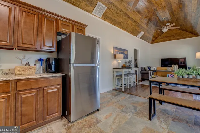 a view of a balcony with wooden floor