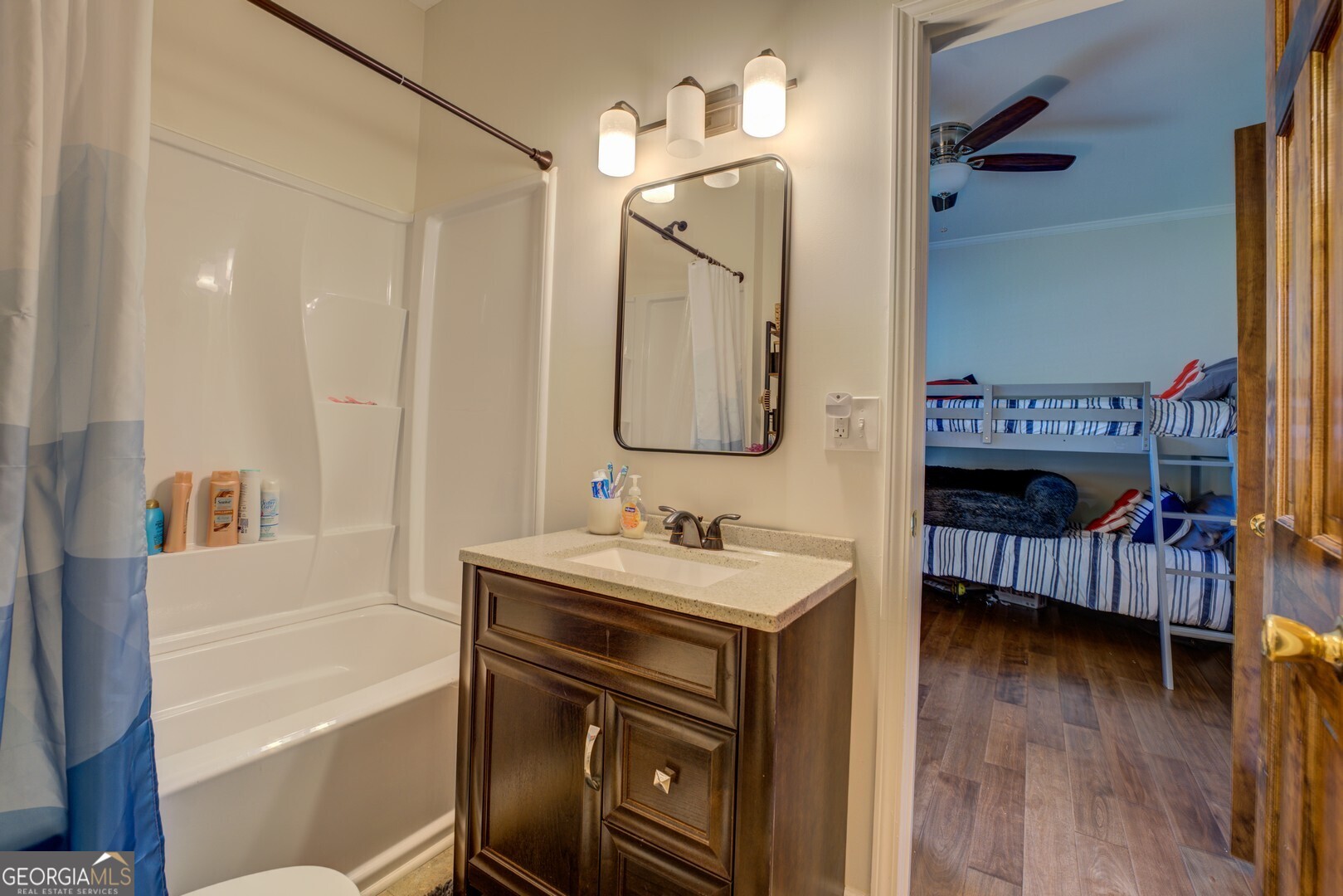 8950 Jackson Lake Road Monticello, GA 31064 - Photo 52 of 88 a bathroom with a sink a toilet and shower