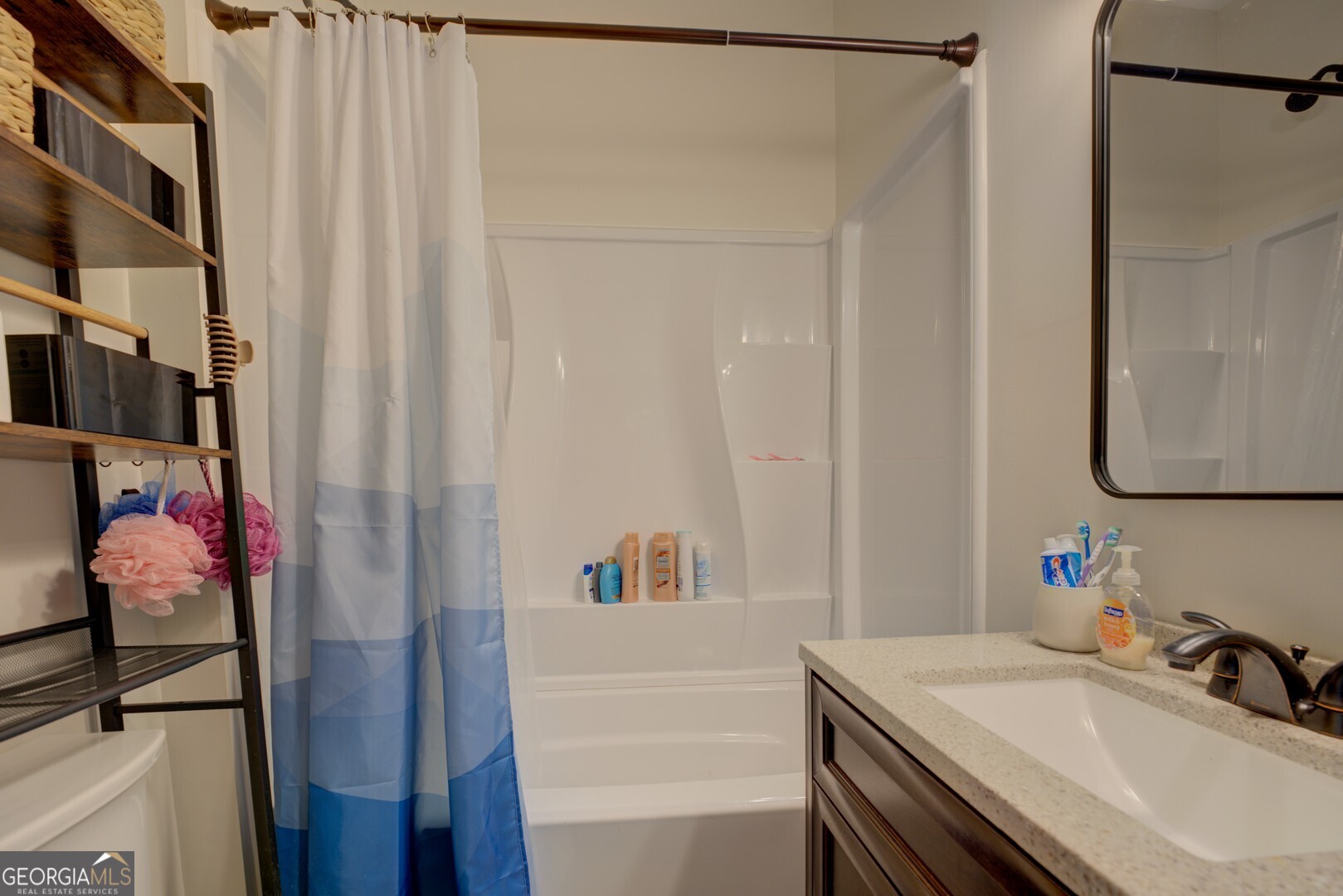 8950 Jackson Lake Road Monticello, GA 31064 - Photo 53 of 88 a bathroom with a sink vanity and a mirror