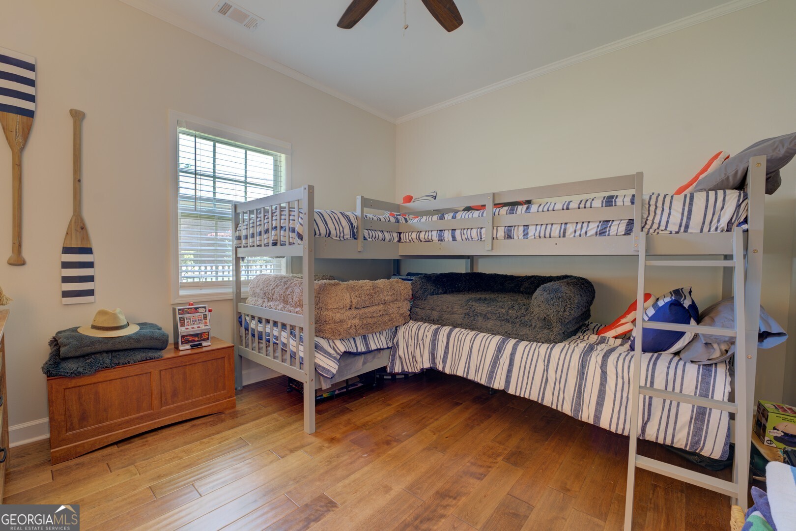 8950 Jackson Lake Road Monticello, GA 31064 - Photo 54 of 88 a bedroom with furniture and a wooden floor