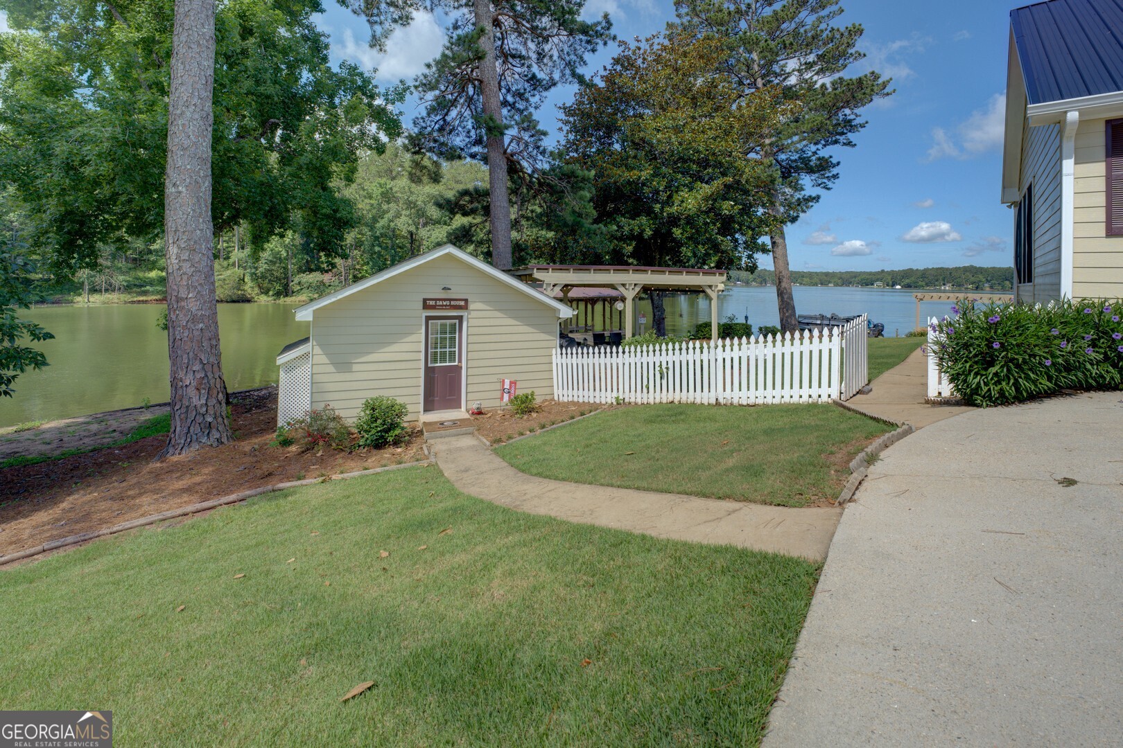 8950 Jackson Lake Road Monticello, GA 31064 - Photo 57 of 88 a view of a yard in front of a house with large tree