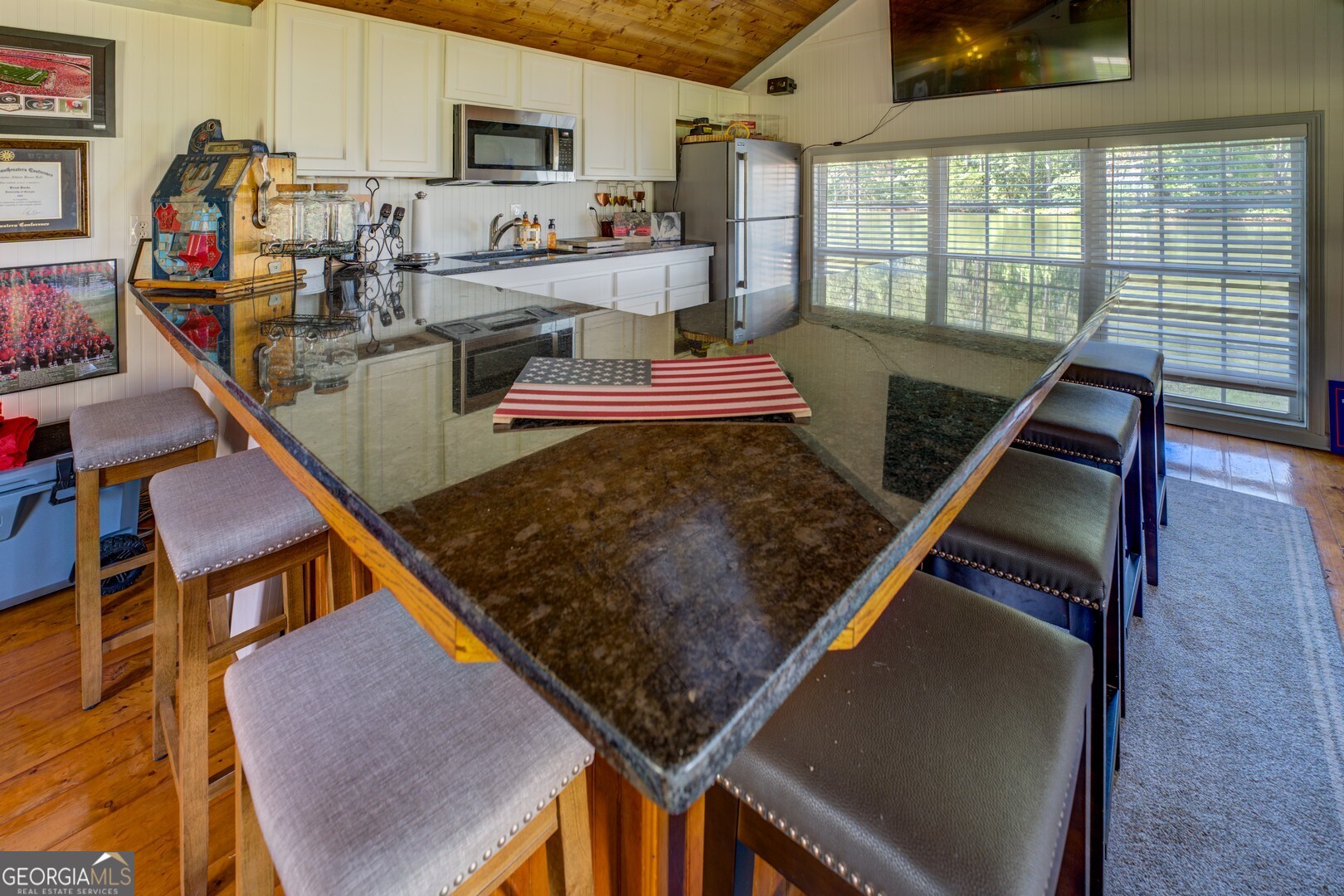 8950 Jackson Lake Road Monticello, GA 31064 - Photo 60 of 88 a kitchen with stainless steel appliances granite countertop a stove top oven a sink and cabinets