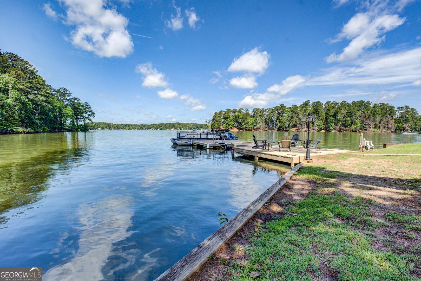 8950 Jackson Lake Road Monticello, GA 31064 - Photo 70 of 88 a view of a lake with a yard